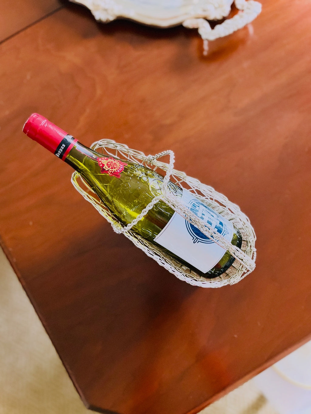 Silver toned wine bottle basket